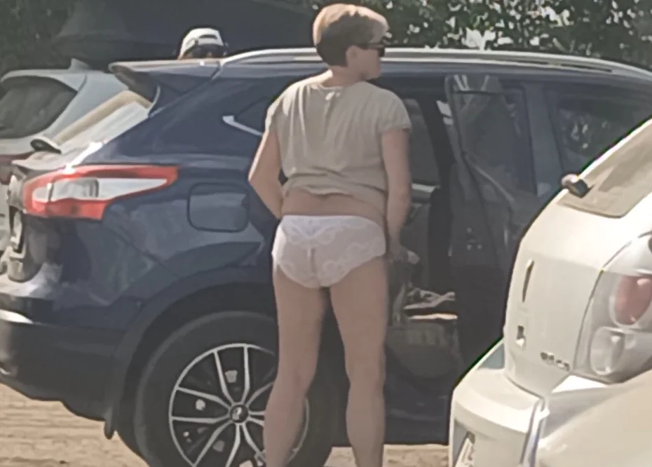 Peeking at my mom as she changes her underwear by the car